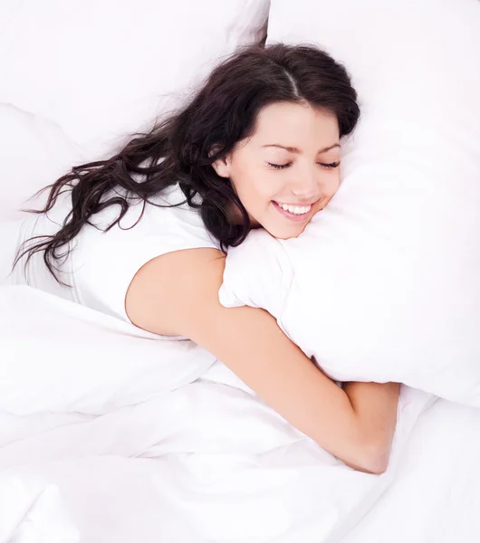 Woman in bed Stock Image