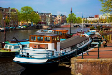 Amsterdam old town canal, boats. clipart