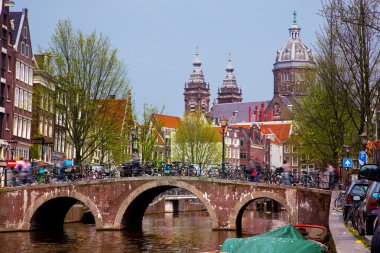 Amsterdam old town canal, boats. clipart