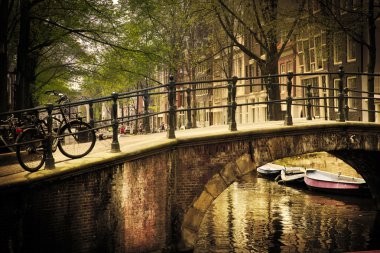 Amsterdam. Romantic bridge over canal. clipart