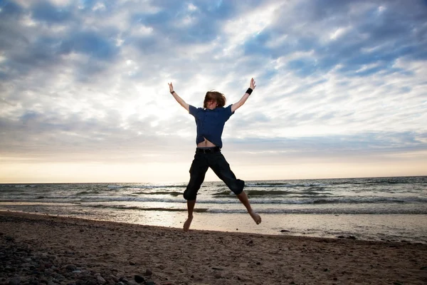 Happy young man jumping — Stock Photo, Image