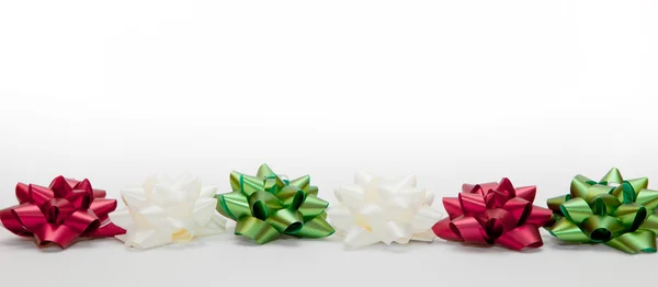 Christmas decoration, colorful ribbon and stars — Stock Photo, Image
