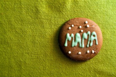 Cookie for Mother's day on green background clipart