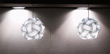 A modern lamp made out of multiple plastic diffusers clipart