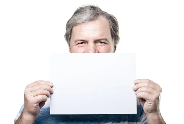 Mature man holding a blank billboard isolated on white background — Stock Photo, Image