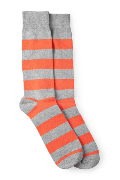 Beyaz arka plan üzerinde izole çift şeritli turuncu ve gri çorap — Stok fotoğraf