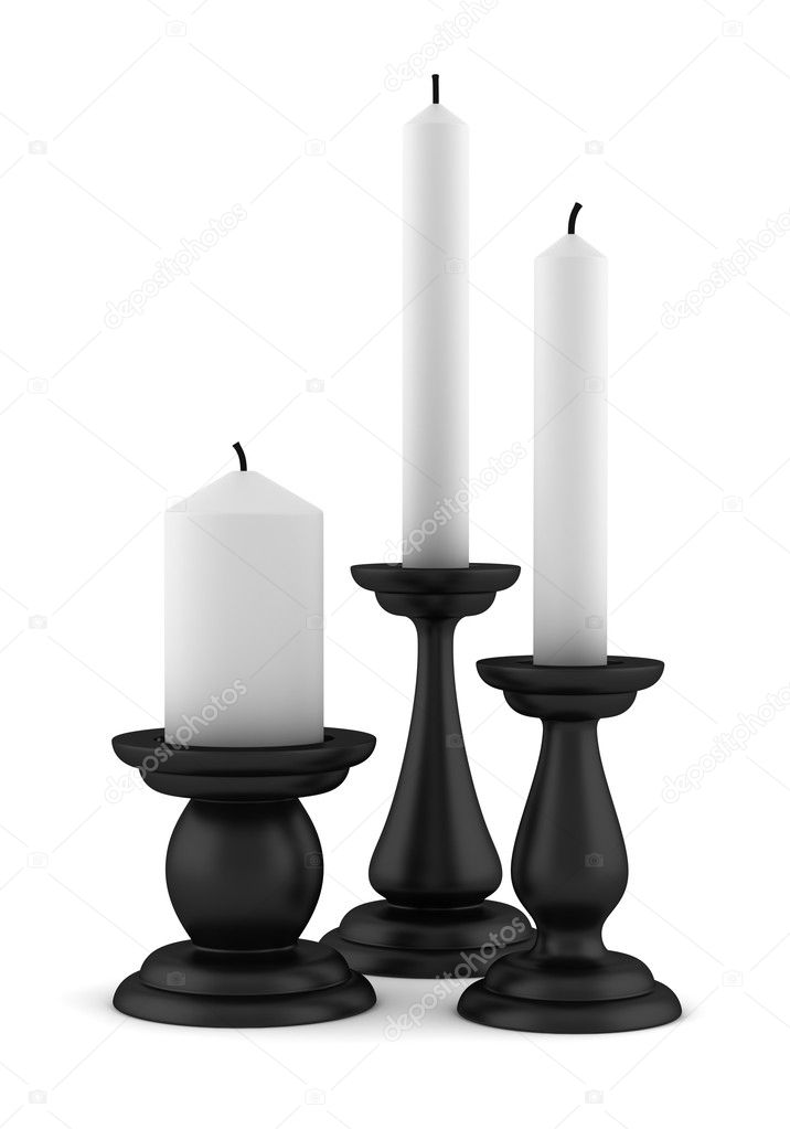 Three black candlesticks with candles isolated on white background