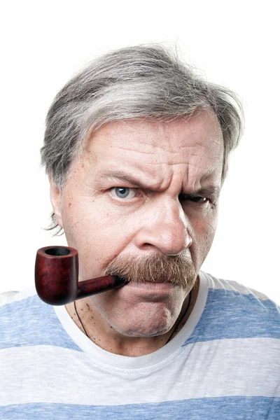 Gloomy mature man with smocking pipe isolated on white background — Stock Photo, Image