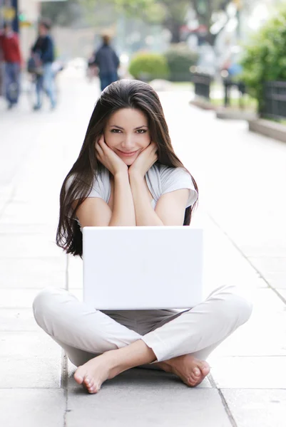 Casual success girl on a laptop — Stock Photo, Image