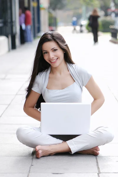 Casual success girl on a laptop — Stock Photo, Image