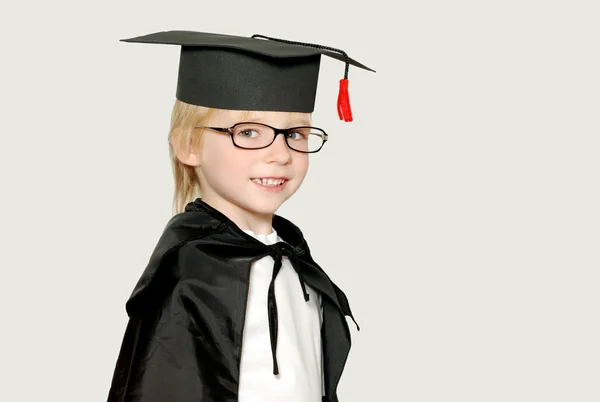 stock image Schoolboy in graduation cap isolated