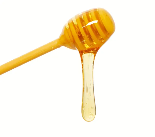 Isolamento del gocciolatore di miele — Foto Stock