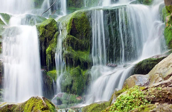 stock image Waterfall with trees and rocks in mountain