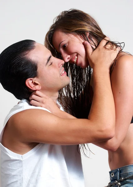 Intimate young couple during foreplay on a light background — Stock Photo, Image