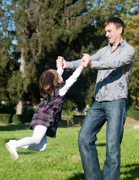 Father and daughter having a good time outdoor