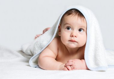 Little baby under white towel clipart
