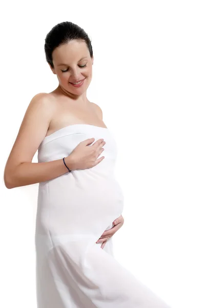 Mladá žena těhotná v bílém — Stock fotografie