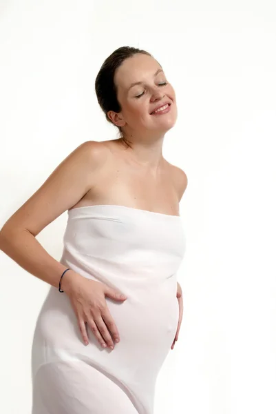 Młoda kobieta w ciąży w biały — Zdjęcie stockowe