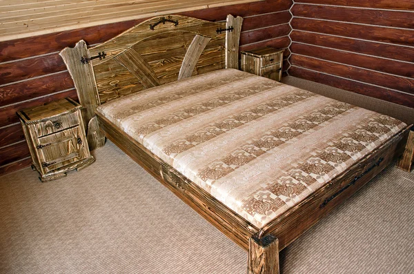 Stock image Bedroom with old-style wooden bed