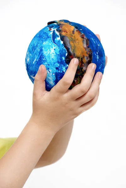 Children 's hands holding globe made the child — стоковое фото