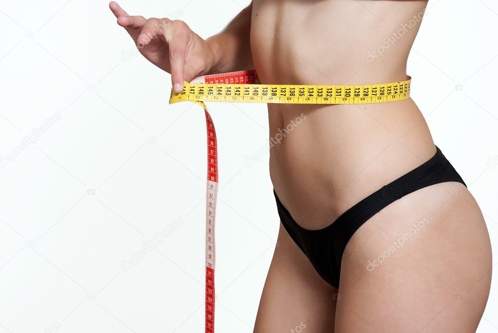 Athletic woman with measure tape