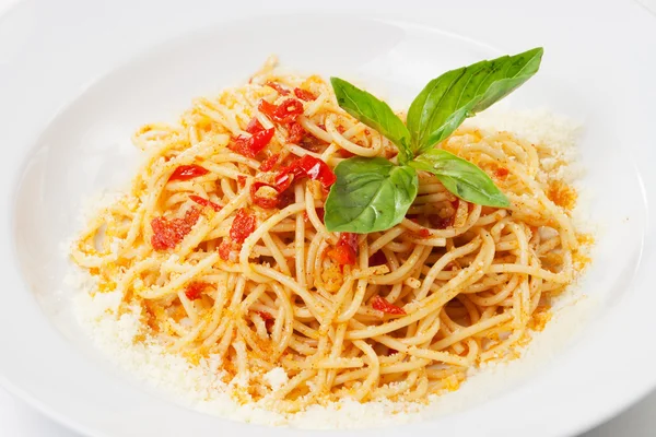 stock image Pasta with sweet bell pepper, basil leaf and parmesan, on white