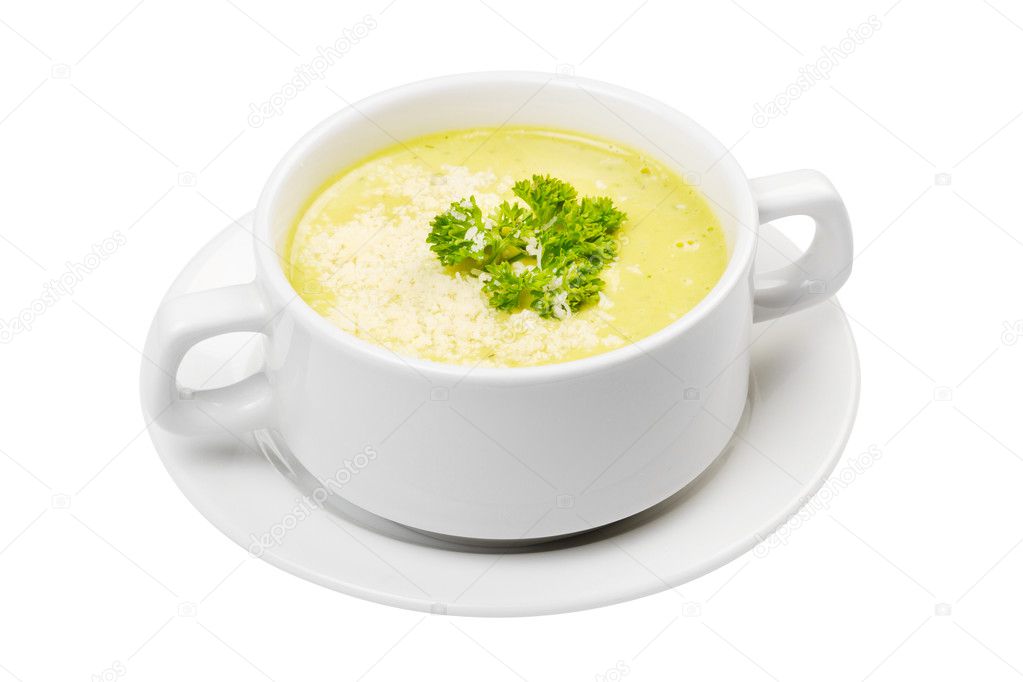 Cream soup in white bowl isolated