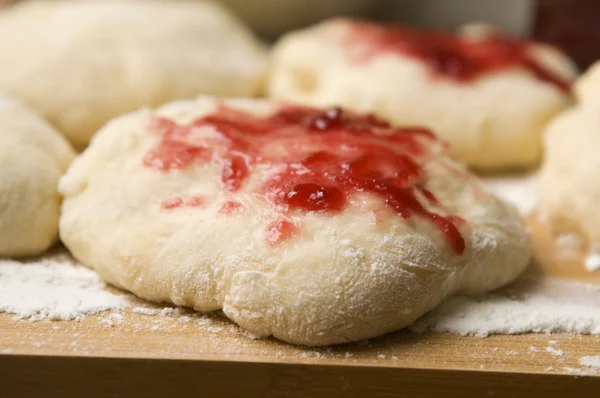 stock image Dough with marmelade on wooden board