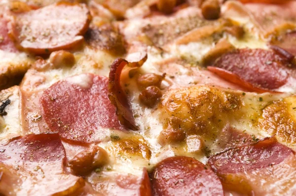 Stock image Italian pizza with bacon, salami and mozzarella cheese