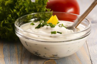 Delicious cream cheese with chives and vegetables clipart