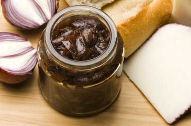 Onion jam in jar, goat's cheese and fresh bread clipart