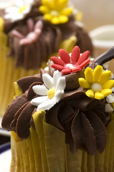 stock image Spring muffins decorated with flower petals with tulips