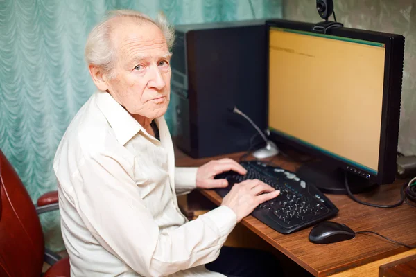 Old Man Working On Computer