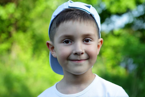 Smiling boy in blue hat — Stock Photo, Image