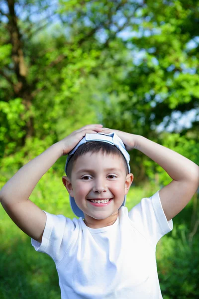 Smiling boy in blue hat — Stock Photo, Image