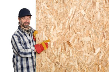 Carpenter points a sheet of plywood clipart