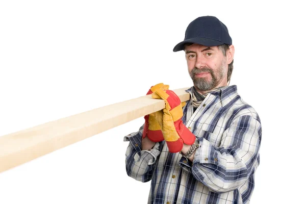 Carpenter holds a plank — Stock Photo, Image