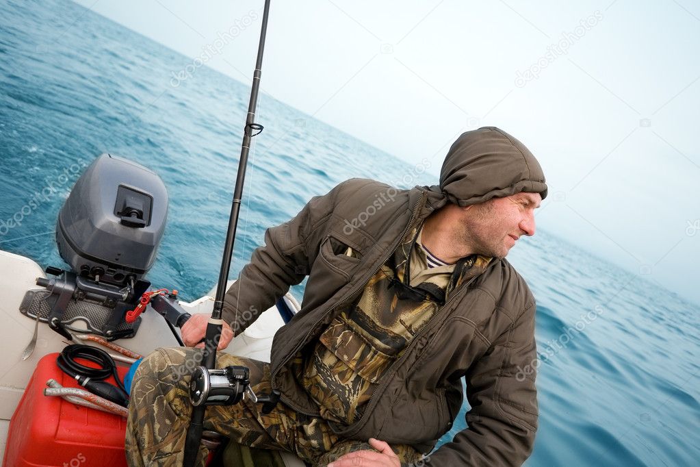 Fisherman fishing a salmon trolling