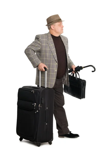 Man in a checkered suit and luggage — Stock Photo, Image