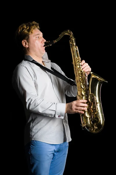Músico com um saxofone — Fotografia de Stock