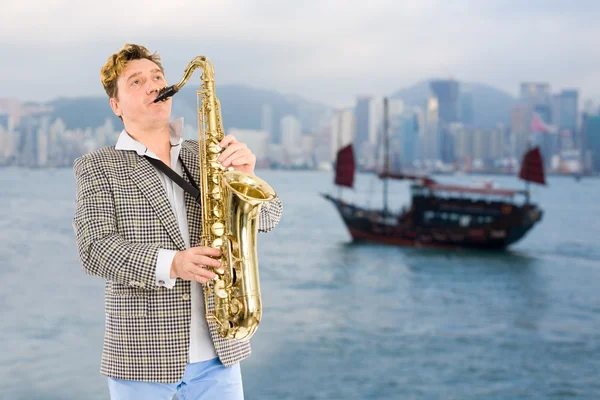 stock image Musician in the background of Hong Kong.