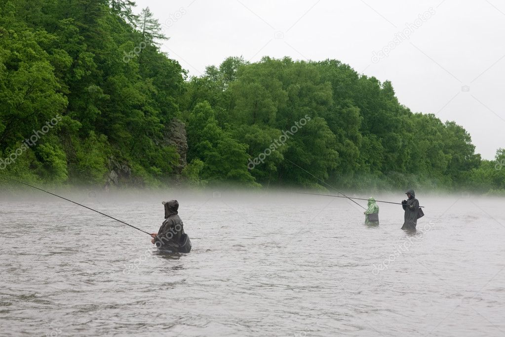 Fishermen catch salmon river