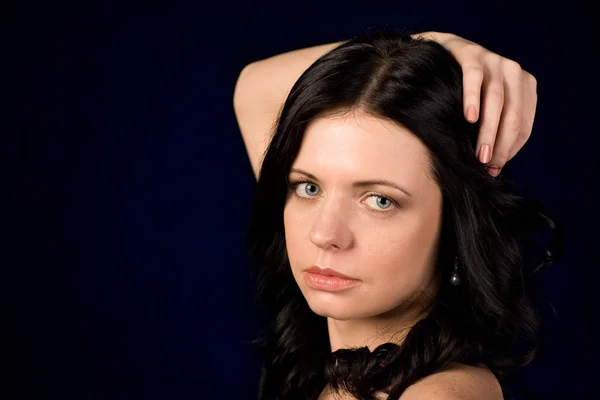 Young woman with a raised hand — Stock Photo, Image