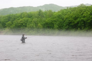 Fisherman in the river clipart