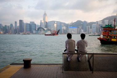 Tourists on the waterfront of Hong Kong clipart