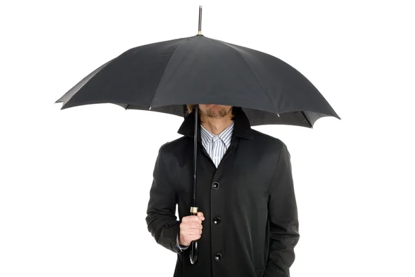 stock image Man standing under an umbrella.