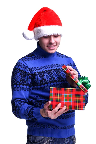 Человек в красной шляпе с подарком — стоковое фото