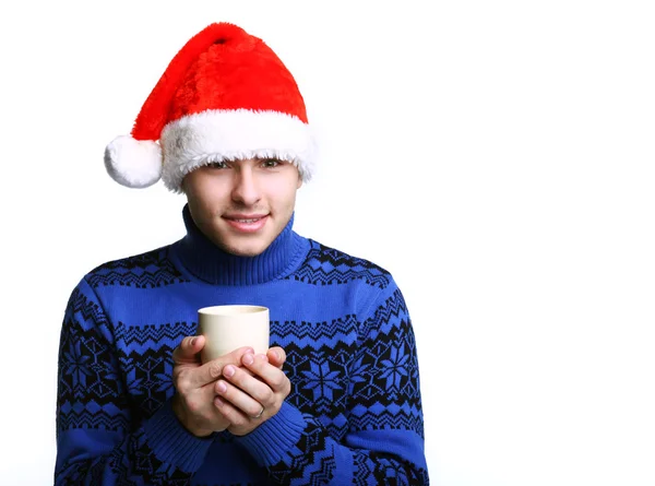 Man in Santa's hat with cup — Stock Photo, Image