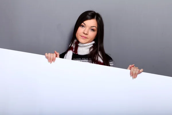 stock image Woman in sweater with placard