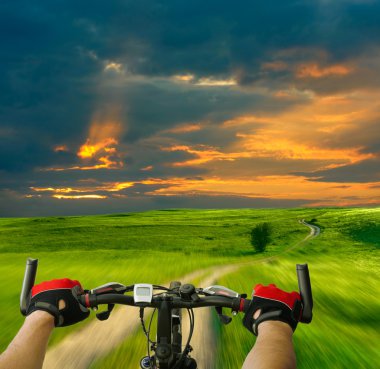 Man with bicycle riding country road clipart